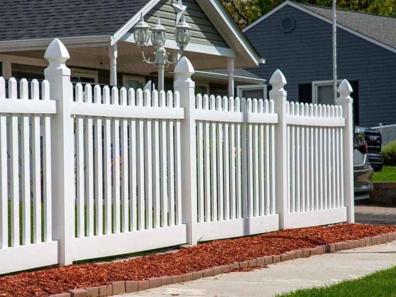 white vinyl fence in residential neighborhood home nature plastic property backyard